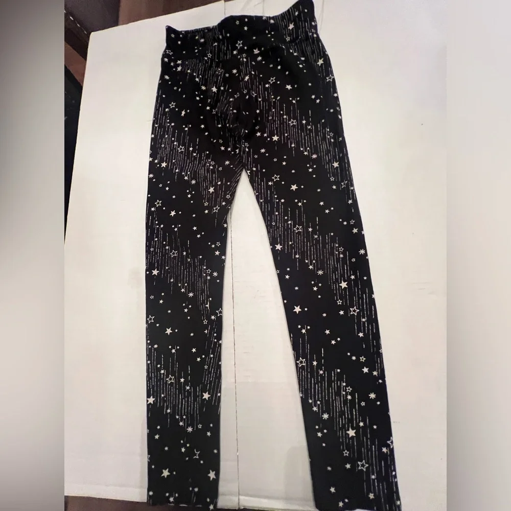 JUSTICE GIRLS LEGGINGS. SIZE 14/16  BLACK WITH STARS AND LINES
